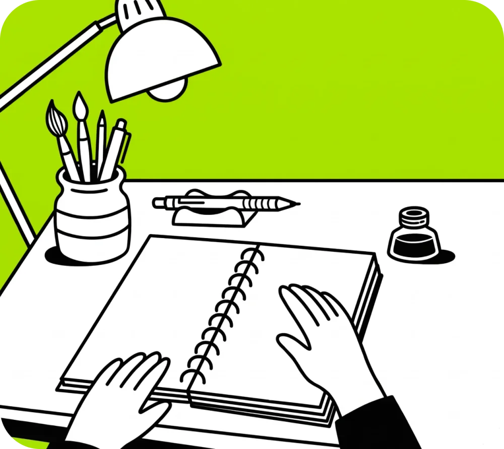 Illustration of hands on an open sketchbook on a desk, with brushes, pencils, a desk lamp and an ink bottle